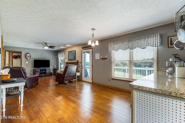 3938 Settlers Trl, Kodak, TN 37764 - living room featuring a textured ceiling, plenty of natural light, hardwood / wood-style floors, and ceiling fan