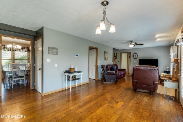 3938 Settlers Trl, Kodak, TN 37764 - living room featuring a chandelier, a ceiling fan, and hardwood / wood-style floors