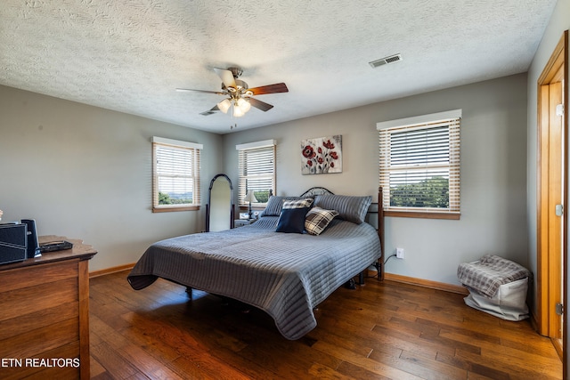 3938 Settlers Trl, Kodak, TN 37764 - bedroom featuring hardwood / wood-style floors, a textured ceiling, and ceiling fan