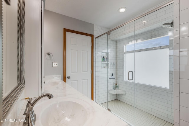 3938 Settlers Trl, Kodak, TN 37764 - bathroom with a stall shower, double vanity, and recessed lighting