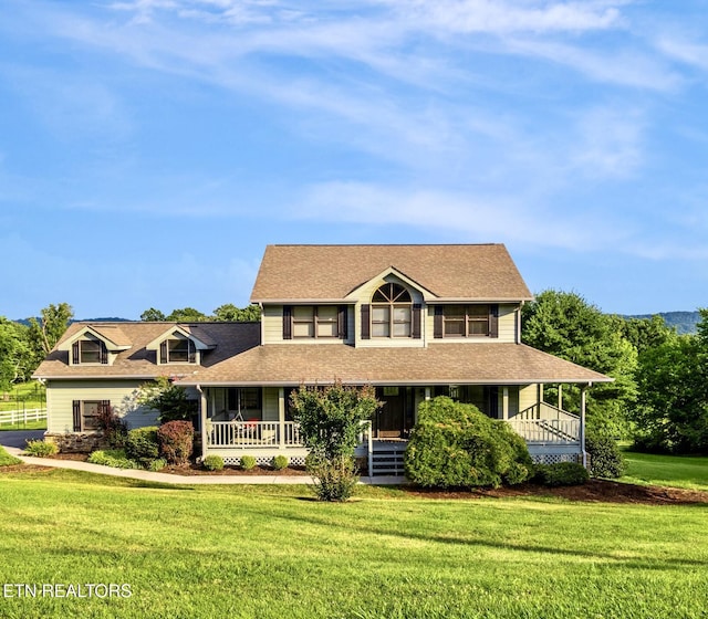 3938 Settlers Trl, Kodak, TN 37764 - country-style home with covered porch, a front lawn, and a shingled roof