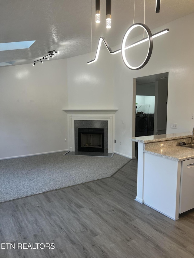 1884 Elmhurst Way, Knoxville, TN 37923 - kitchen with dishwasher, open floor plan, washing machine and clothes dryer, and wood finished floors