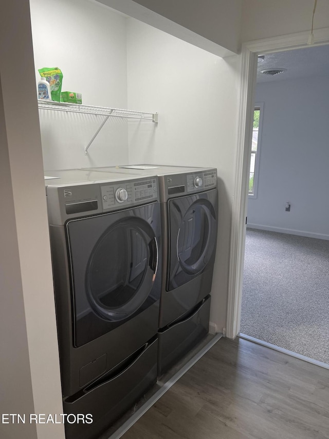 1884 Elmhurst Way, Knoxville, TN 37923 - laundry area featuring washer and dryer, carpet floors, and wood finished floors