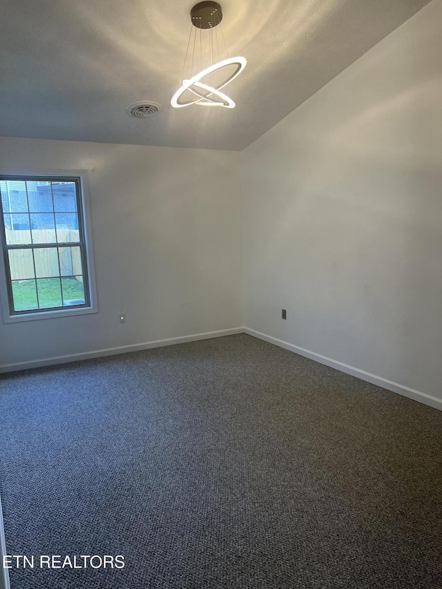 1884 Elmhurst Way, Knoxville, TN 37923 - spare room featuring dark carpet and a chandelier