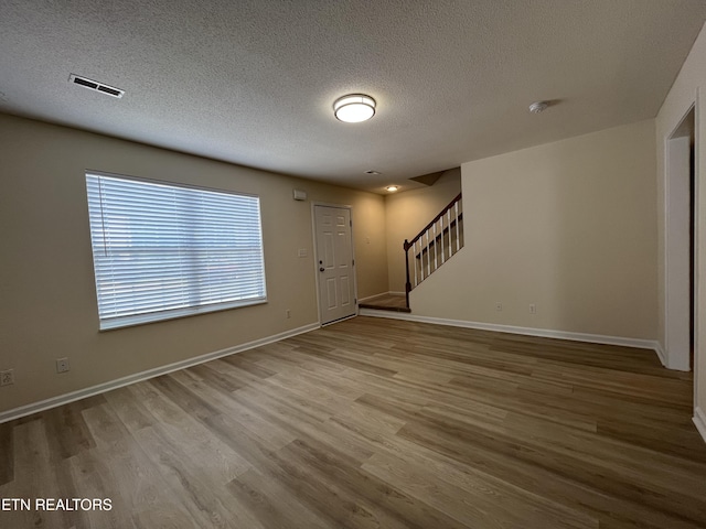 4709 Scepter Way, Knoxville, TN 37912 - entrance foyer featuring stairs, wood finished floors, and a textured ceiling