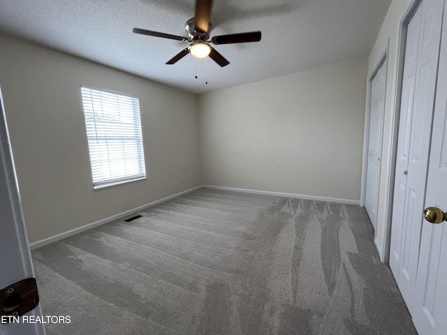 4709 Scepter Way, Knoxville, TN 37912 - unfurnished bedroom featuring carpet floors, a ceiling fan, a closet, and a textured ceiling