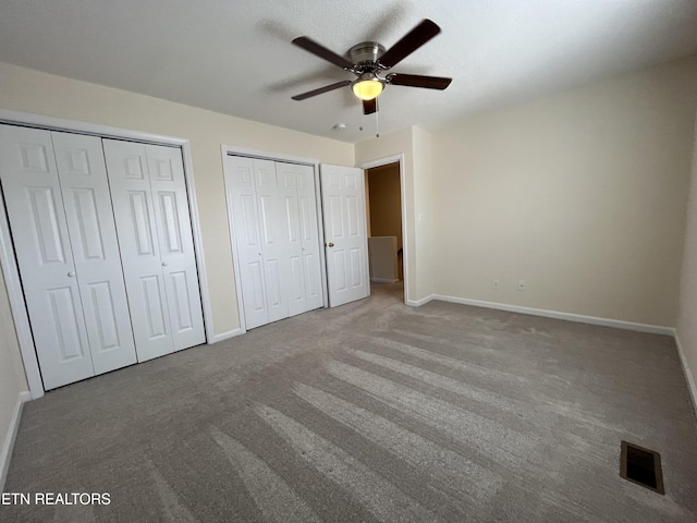 4709 Scepter Way, Knoxville, TN 37912 - unfurnished bedroom with two closets, carpet floors, and ceiling fan