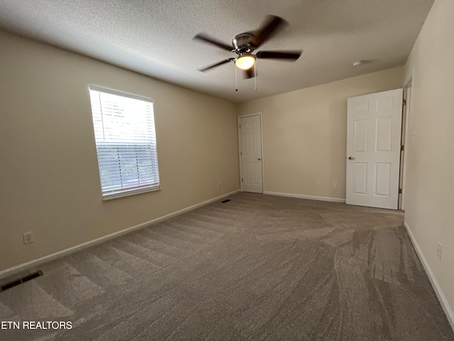 4709 Scepter Way, Knoxville, TN 37912 - unfurnished bedroom with carpet flooring, a textured ceiling, and a ceiling fan