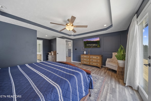 1033 Sunset View Rd, Sevierville, TN 37876 - bedroom with a tray ceiling, wood finished floors, ceiling fan, and recessed lighting