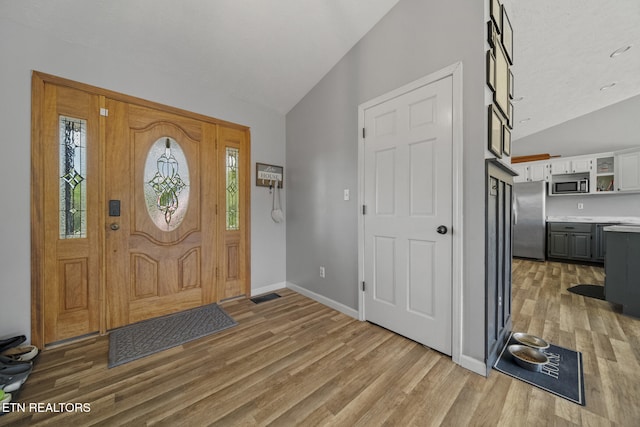 1033 Sunset View Rd, Sevierville, TN 37876 - foyer entrance featuring vaulted ceiling and light wood-style floors