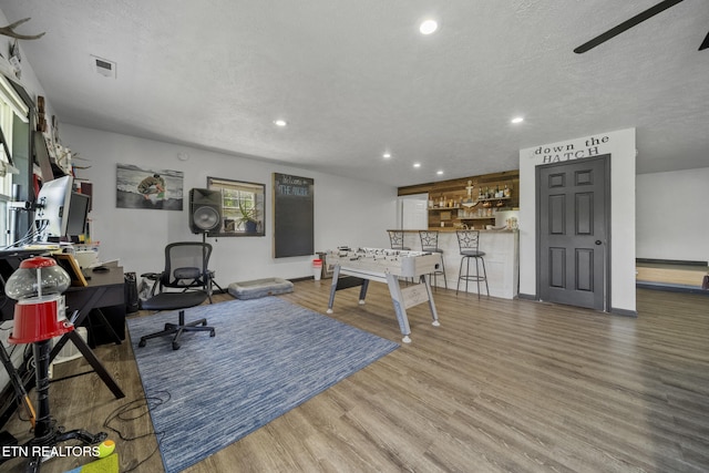 1033 Sunset View Rd, Sevierville, TN 37876 - recreation room featuring wood finished floors, recessed lighting, a textured ceiling, and a desk