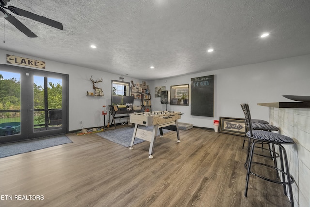 1033 Sunset View Rd, Sevierville, TN 37876 - playroom with wood finished floors, a textured ceiling, recessed lighting, and a ceiling fan