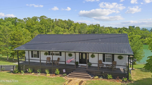 1033 Sunset View Rd, Sevierville, TN 37876 - view of front facade featuring a front yard, a metal roof, and covered porch