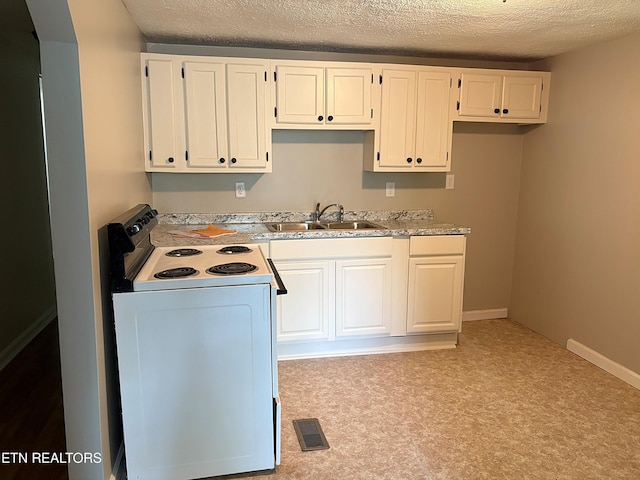 278 Buell Hill Rd, Pineville, KY 40977 - kitchen with white electric range oven, a textured ceiling, white cabinets, light countertops, and light colored carpet