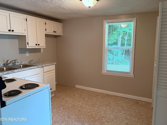 278 Buell Hill Rd, Pineville, KY 40977 - kitchen featuring a textured ceiling, electric stove, white cabinetry, light countertops, and light colored carpet