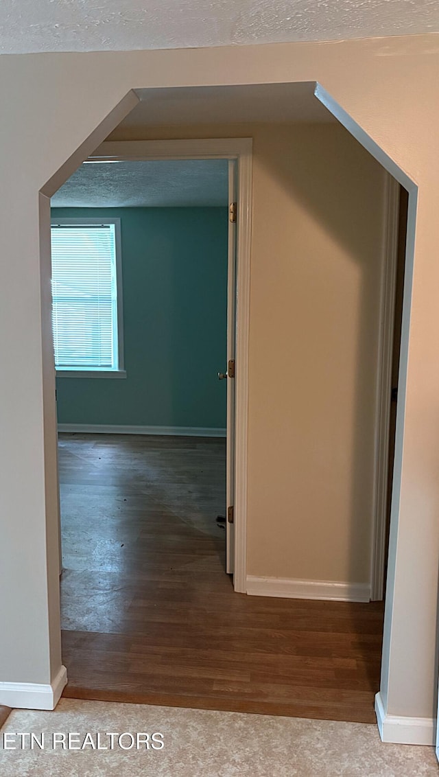 278 Buell Hill Rd, Pineville, KY 40977 - corridor with wood finished floors and a textured ceiling