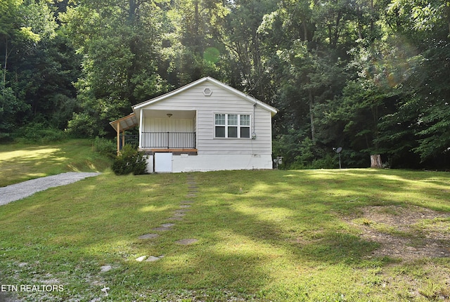 278 Buell Hill Rd, Pineville, KY 40977 - view of front of property with a front yard and a forest view