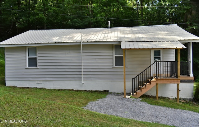278 Buell Hill Rd, Pineville, KY 40977 - view of side of home featuring a yard and a metal roof