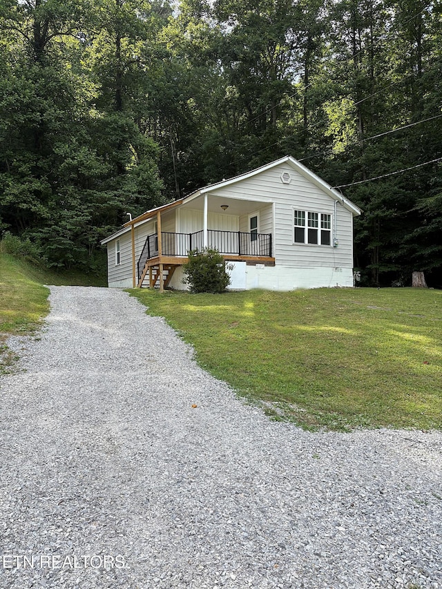 278 Buell Hill Rd, Pineville, KY 40977 - view of front of property featuring driveway, a front lawn, and a wooded view