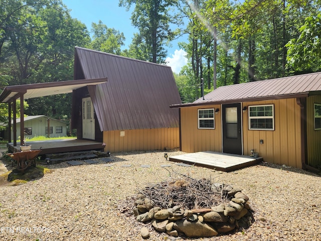 151 Stonewall Way, Cosby, TN 37722 - view of property exterior with a metal roof and an outdoor fire pit