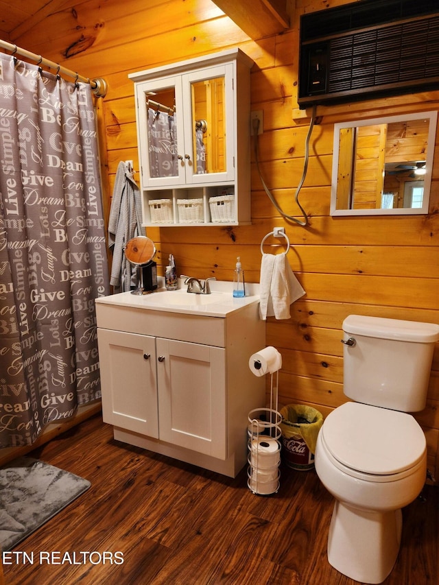 151 Stonewall Way, Cosby, TN 37722 - full bath featuring vanity, a wall unit AC, wood finished floors, wooden walls, and curtained shower