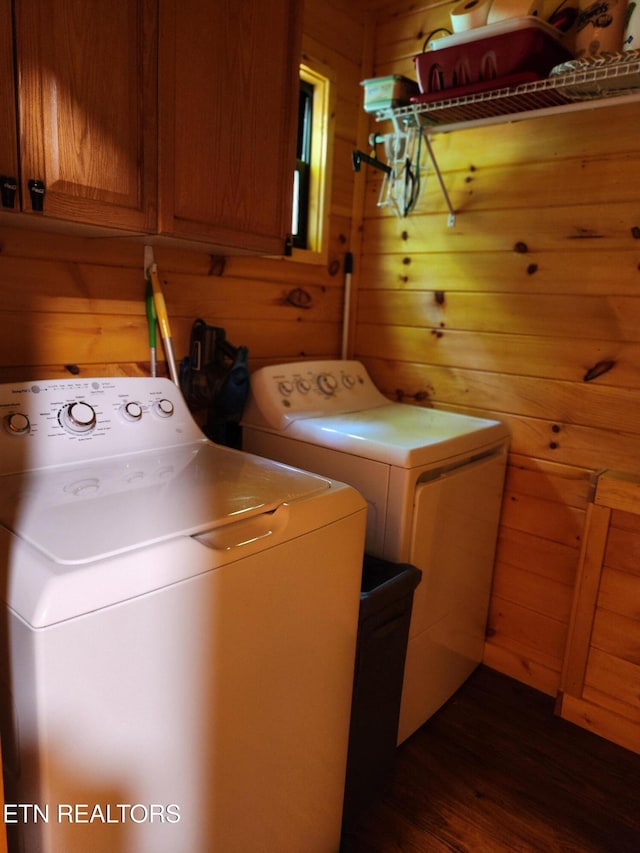 151 Stonewall Way, Cosby, TN 37722 - laundry room with wood walls, washer and dryer, cabinet space, and dark wood-style flooring