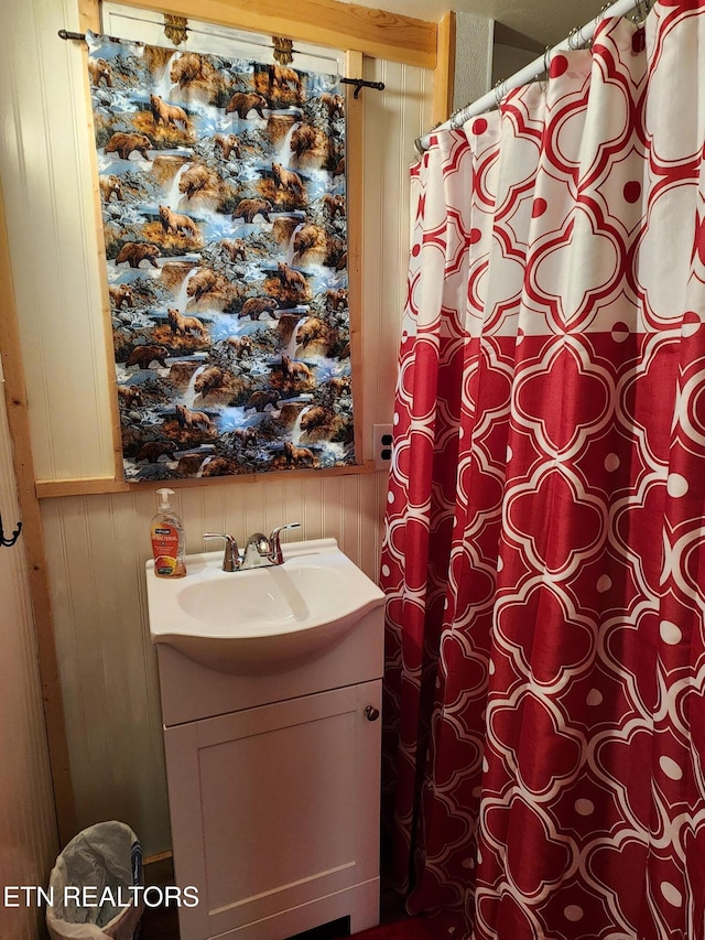 151 Stonewall Way, Cosby, TN 37722 - full bathroom featuring vanity, a shower with curtain, and wood walls