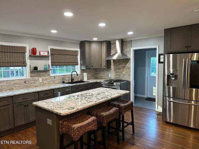 8024 Sharp Rd, Powell, TN 37849 - kitchen with stainless steel appliances, wall chimney range hood, ornamental molding, a breakfast bar, and tasteful backsplash