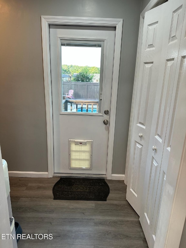 8024 Sharp Rd, Powell, TN 37849 - doorway featuring wood finished floors and heating unit