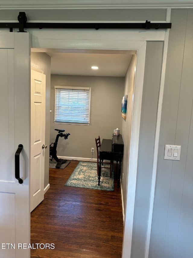 8024 Sharp Rd, Powell, TN 37849 - hallway with a barn door and dark wood-type flooring
