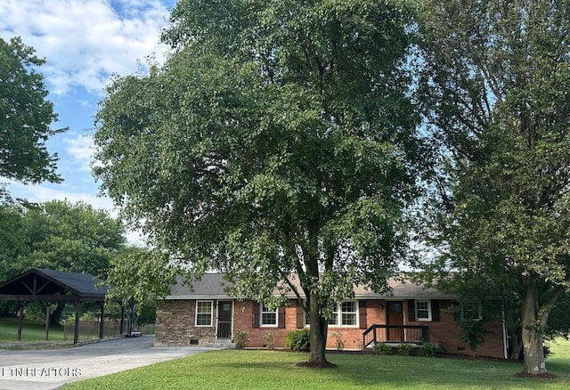 8024 Sharp Rd, Powell, TN 37849 - ranch-style home with a front lawn, crawl space, brick siding, and driveway