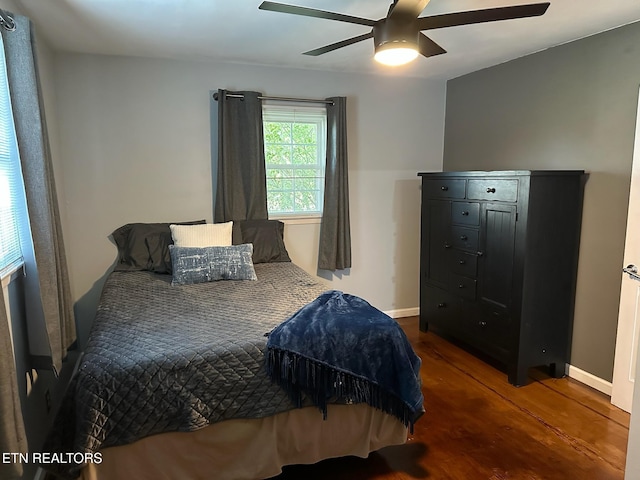 8024 Sharp Rd, Powell, TN 37849 - bedroom with dark wood-style floors and ceiling fan
