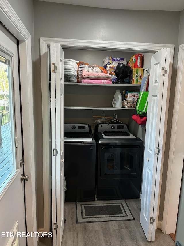 8024 Sharp Rd, Powell, TN 37849 - laundry room with independent washer and dryer and wood finished floors