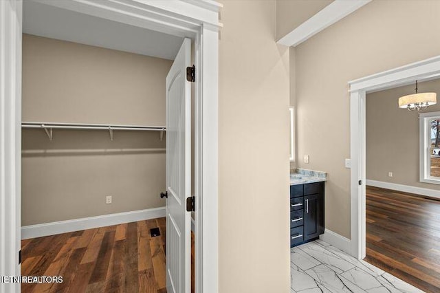 455 Sunset Harbor Dr, Dandridge, TN 37725 - walk in closet featuring wood finished floors and a chandelier