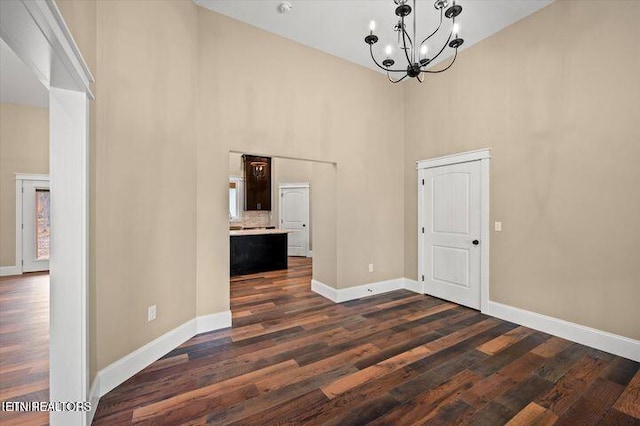 455 Sunset Harbor Dr, Dandridge, TN 37725 - unfurnished dining area featuring a high ceiling, a chandelier, and dark wood finished floors