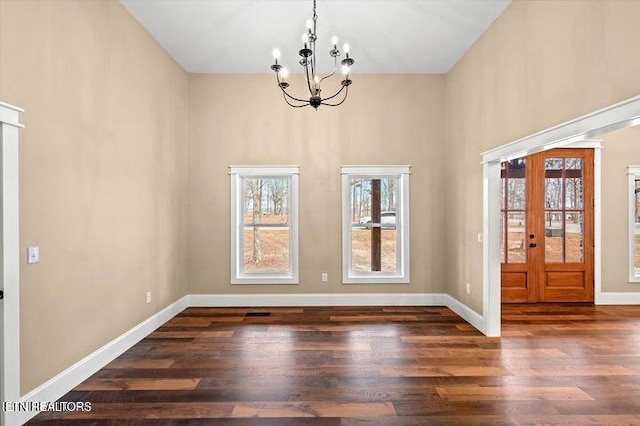 455 Sunset Harbor Dr, Dandridge, TN 37725 - unfurnished dining area with a chandelier, wood finished floors, and a towering ceiling