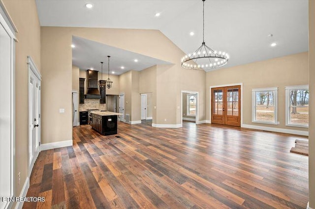 455 Sunset Harbor Dr, Dandridge, TN 37725 - unfurnished living room with dark wood-style floors, high vaulted ceiling, a chandelier, and recessed lighting