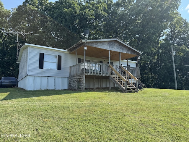Ousley Crst, Cumberland Gap, TN 37724 - view of front of house with a front lawn, stairs, and covered porch