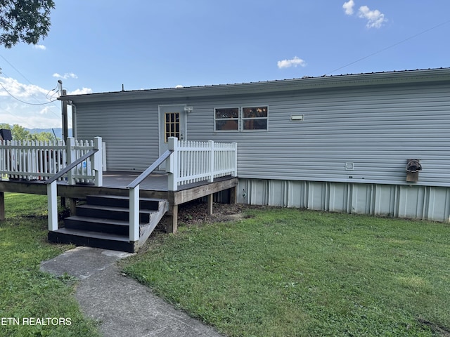 Ousley Crst, Cumberland Gap, TN 37724 - back of property with a lawn, a deck, and a metal roof