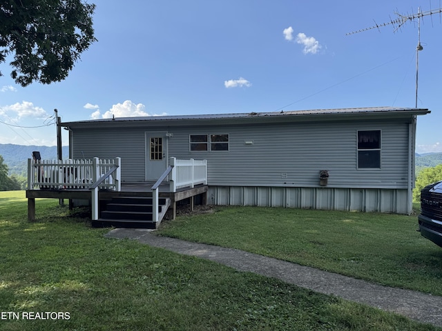 Ousley Crst, Cumberland Gap, TN 37724 - rear view of house featuring a wooden deck and a yard