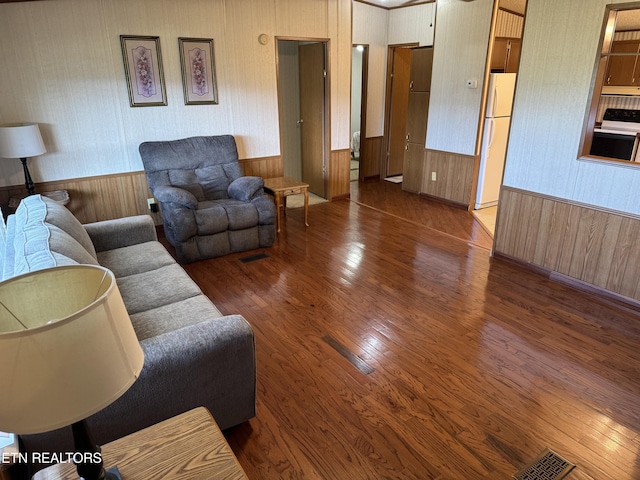 Ousley Crst, Cumberland Gap, TN 37724 - living room featuring wood finished floors, wainscoting, wallpapered walls, and wooden walls