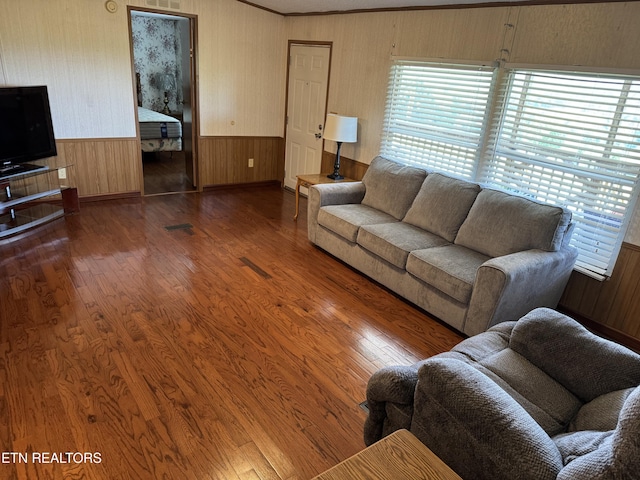 Ousley Crst, Cumberland Gap, TN 37724 - living area featuring plenty of natural light, wood finished floors, wood walls, wainscoting, and crown molding