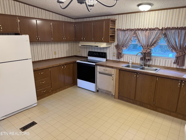 Ousley Crst, Cumberland Gap, TN 37724 - kitchen featuring freestanding refrigerator, electric range, wallpapered walls, a textured ceiling, and crown molding