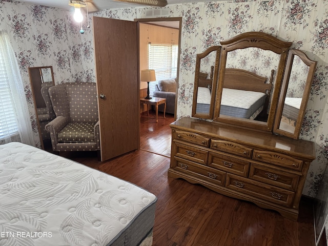 Ousley Crst, Cumberland Gap, TN 37724 - bedroom featuring wallpapered walls and dark wood-style flooring