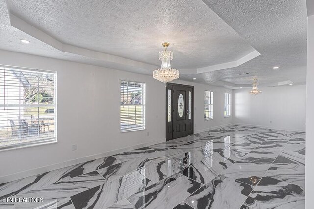 1220 Ariell Lea, Sevierville, TN 37862 - entryway featuring a chandelier, a raised ceiling, a textured ceiling, healthy amount of natural light, and recessed lighting