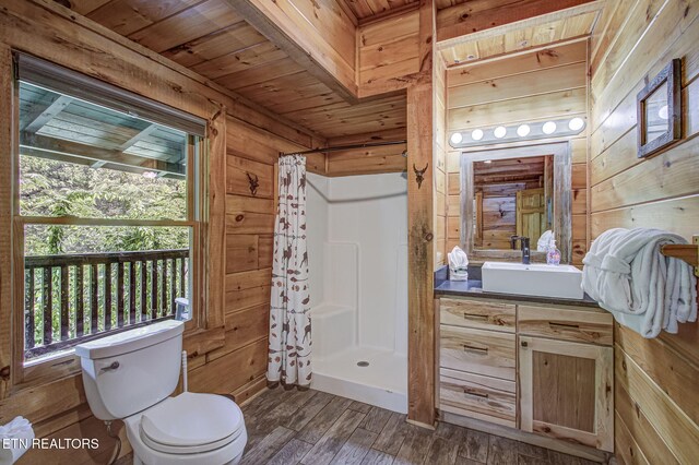 3012 Oak Tree Way, Pigeon Forge, TN 37863 - full bath featuring wood walls, vanity, a shower stall, wood finished floors, and wooden ceiling