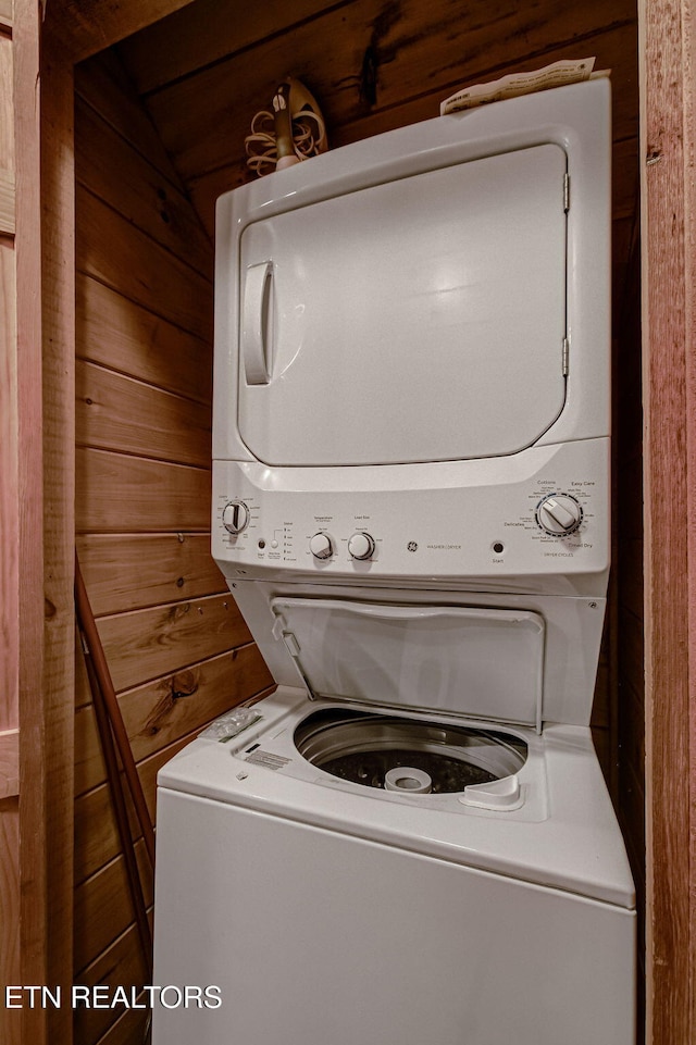 3012 Oak Tree Way, Pigeon Forge, TN 37863 - washroom featuring stacked washing machine and dryer and wooden walls