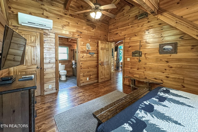 3012 Oak Tree Way, Pigeon Forge, TN 37863 - bedroom featuring hardwood / wood-style floors, a wall unit AC, wooden walls, ensuite bathroom, and wood ceiling