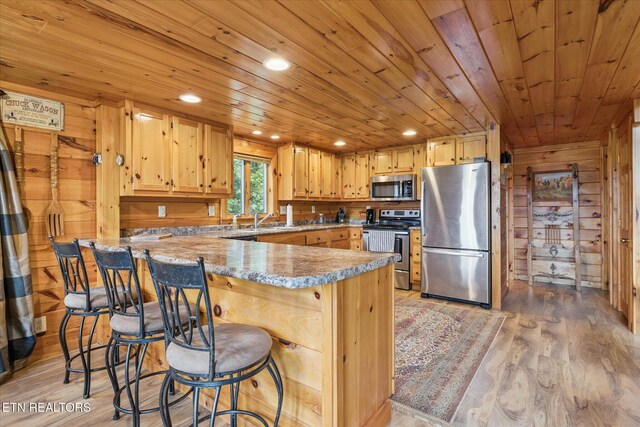 1818 Saddle Way, Sevierville, TN 37876 - kitchen featuring stainless steel appliances, wooden ceiling, a peninsula, light wood-style floors, and recessed lighting