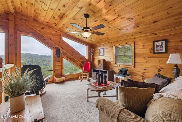 1818 Saddle Way, Sevierville, TN 37876 - carpeted living room featuring a ceiling fan, vaulted ceiling, wood walls, wooden ceiling, and a mountain view
